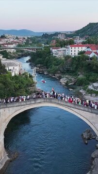 Aerial view of Mostar Old Bridge and historic old town by the river.