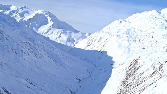 Aerial Drone Footage of Vast Snow-Covered Alpine Slopes and Peaks in Uri Alps, Switzerland