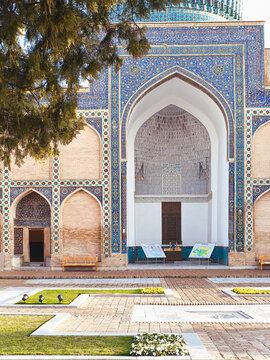 Gur-e-Amir mausoleum facade with ornate blue tilework and pointed arch iwan in Samarkand Uzbekistan. Historic Timurid architecture ideal for travel publications and cultural heritage projects.