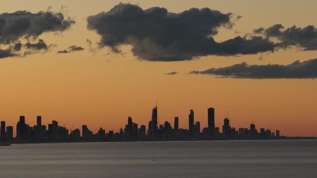 Dark Clouds Over Surfers Paradise, Broadbeach And Main Beach Skyline At Sunset - Gold Coast, Queensland, Australia. - aerial shot