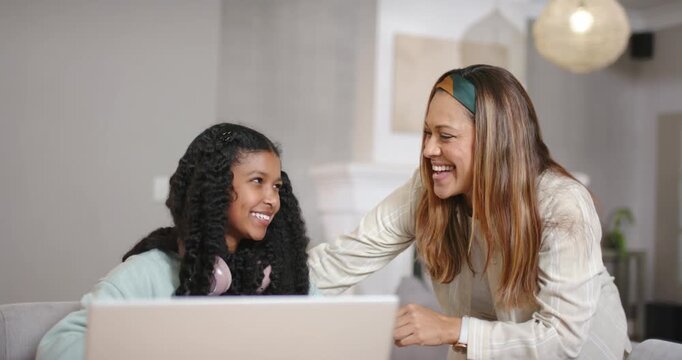 African American mom-daughter high-fiving after youth raising hand leaning at table laptop red pen