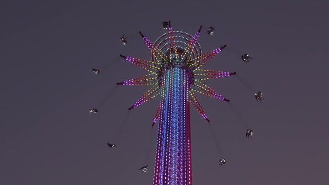 SkyFlyer Ride At Asiatique The Riverfront With Colorful Neon Lights In Bangkok, Thailand. - low angle shot
