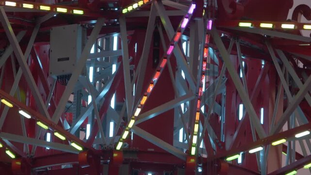 Close Up View Of The Illuminated Rotating Ride Hub Descending Along The Skyflyer Tower At Asiatique The Riverfront In Bangkok, Thailand