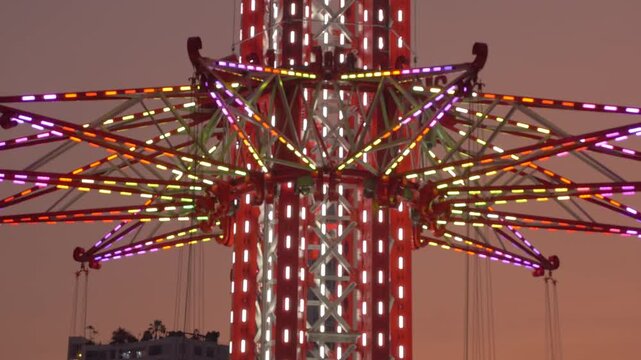 Close Up View Of The Illuminated Central Hub Of The Asiatique Skyflyer Against The Evening Sky Along The Chao Phraya River In Bangkok, Thailand