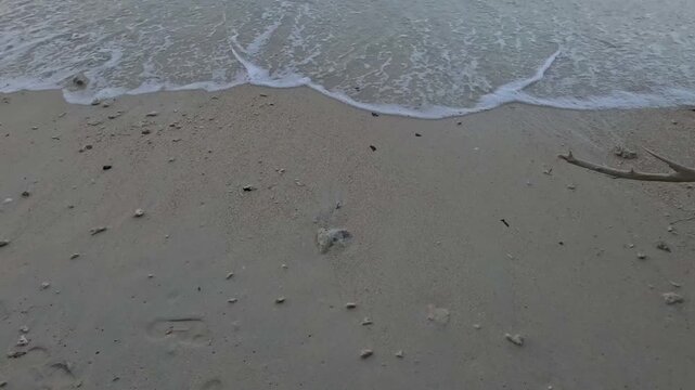 Kalapathar Beach in Havelock Island, Andaman, India - Sea waves washing the sandy shore at sunrise.
