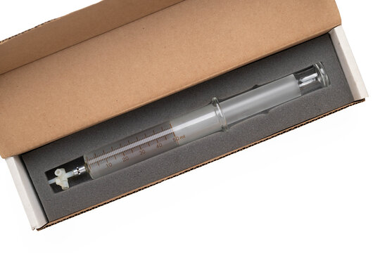 50 ml frosted glass syringe, orange markings, and three-way stop-cock attachment in a padded cardboard box on white background