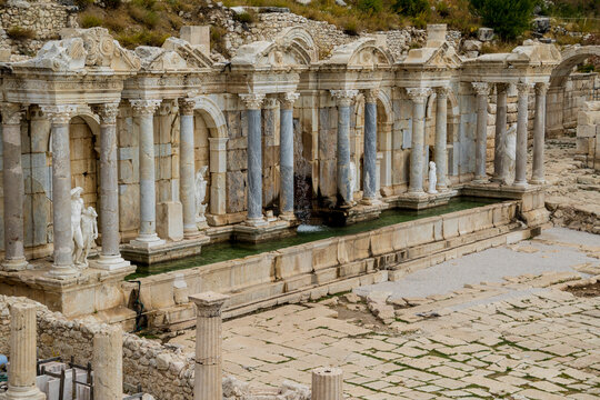 Ancient Antonine Nymphaeum fountain with statues in Sagalassos antique city, Burdur, Turkey.