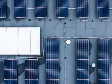 Aerial view of solar panels installed on the roof of a cheese factory in Ikskile, Ogre Municipality, Latvia.