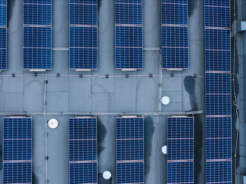 Aerial view of solar panels installed on the roof of a cheese factory in Ikskile, Ogre Municipality, Latvia.
