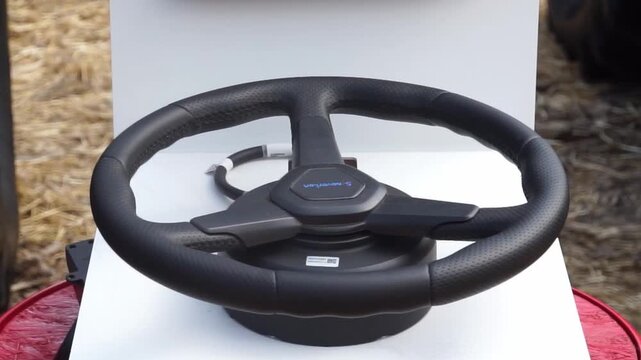 A driving training simulator automatically rotates the steering whell left and right.