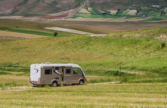 Camper van o motor home at beautiful panoramic road. Travel adventure vacation Italy
