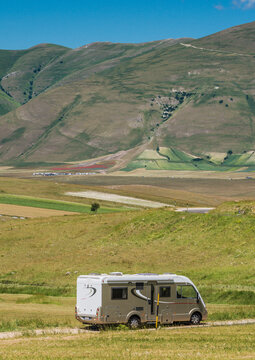 Camper van o motor home at beautiful panoramic road. Travel adventure vacation.