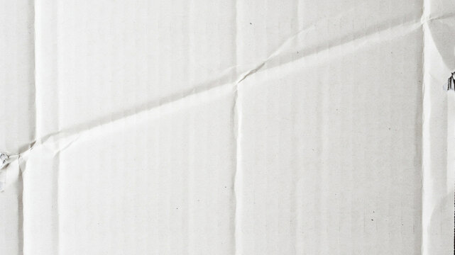 Crumpled white cardboard box, corrugated paper texture, packaging material, close-up