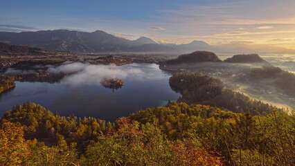 Colorful misty sunrise over the lake (Blejsko Jezero), the Assumption of Mary church and the castle, seen from Mala Osojnica hill. Bled-Slovenia-081