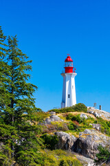 colorful lighthouse on the rocky coast of British Columbia © William Cobb