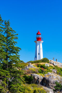 colorful lighthouse on the rocky coast of British Columbia