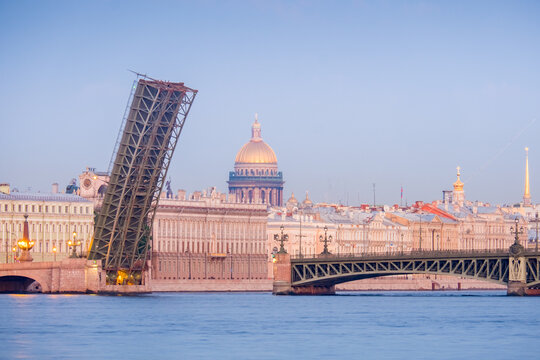 Drawbridge Trinity Bridge over the Neva River during White Nights with View of Saint Isaac Cathedral and Palace Embankment