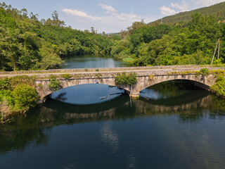 Fototapeta premium Galicia rural stone bridge crossing river