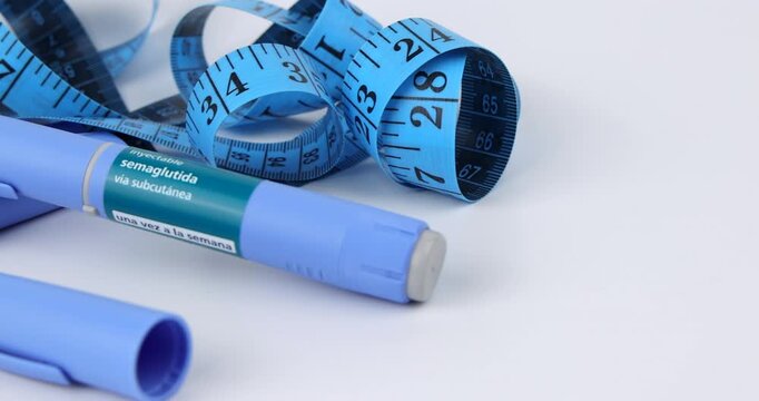 Side camera slide layout of blue semaglutide medication pens for chronic obesity treatment and health care on white background zone