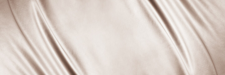 Fototapeta premium Light brown beige textile fabric. Elegant luxury background. Soft folds, curved lines. Nude pastel. Beauty branding fashion wedding. Premium cosmetic design. Empty template. Flat lay, table top view.