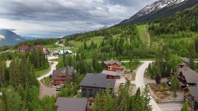 Aerial View of Kicking Horse Mountain Resort with Green Ski Runs and Mountain Chalet, Golden BC
