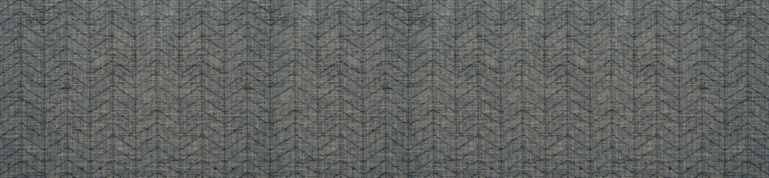 Wide panoramic banner of dark grey woven fabric with subtle herringbone chevron pattern