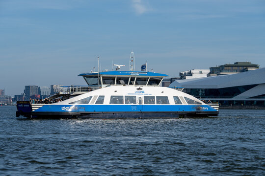 Amsterdam, Netherlands - 15 Apr 25: GVB passenger ferry crossing the IJ river in Amsterdam