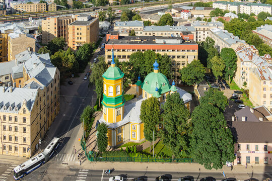 Unexpected Riga with a historic ortodox church surrounded by mature trees and residential neighborhoods for local heritage and overlooked city stories.
