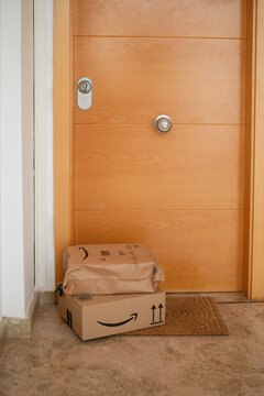 Alicante, Spain - February 02, 2026: Amazon Prime delivery package and box sits on doormat in front of entrance door
