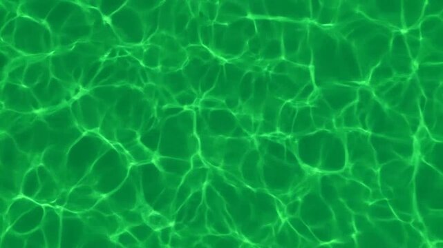 Abstract green water surface with bright caustic light patterns