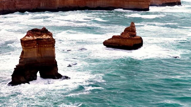 Surface to coastal erosion rocks and sunrise cloudy sky at Twelve Apostles national park.