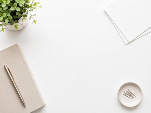 Minimal office desk flat lay with notebook, coffee cup and copy space