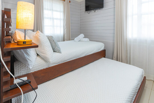 Cozy bedroom featuring a practical trundle bed and wooden furniture