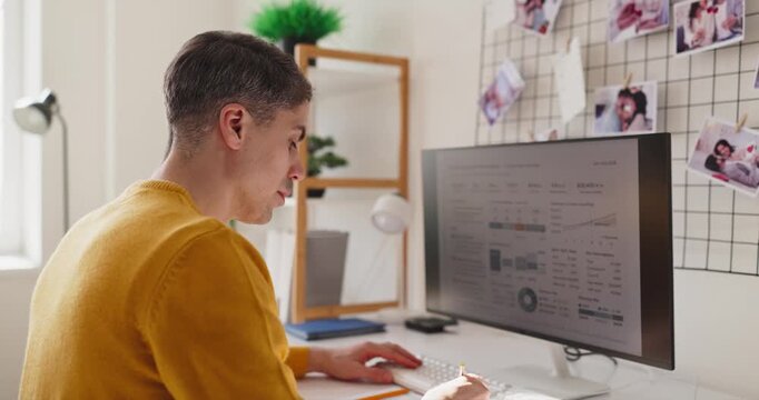 Freelancer man analyst at home office computer. Data dashboard on the monitor shows charts and metrics, supporting analysis and remote performance tracking. Remote productivity concept for work.