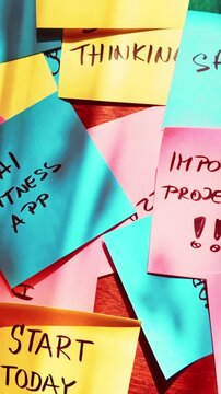 A colorful collection of reminders and goals creates a visual roadmap for daily productivity and self-improvement. Suitable for motivation and planning themes.