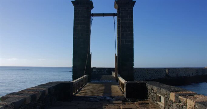 Tilting down shot looking onto the Puente de las Bolas, bridge of balls. At Arrecife
