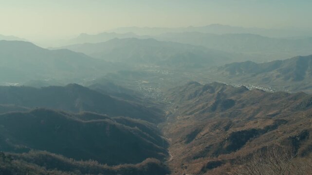 Beijing Panoramic aerial view of misty mountain valleys and rural settlements