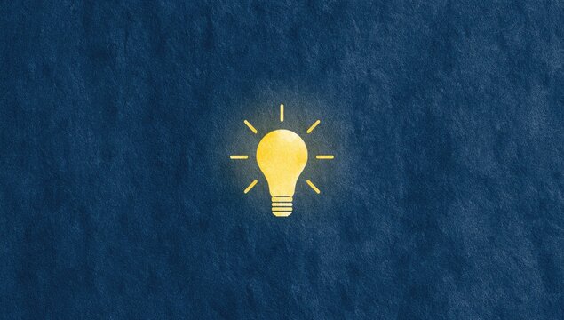 A bright yellow incandescent lightbulb glows on a textured dark blue background