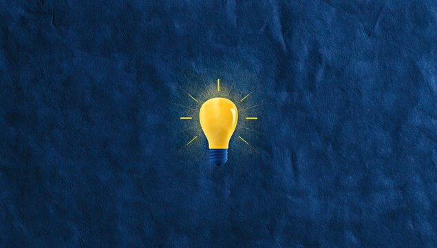 Bright yellow bulb glows on textured dark blue background