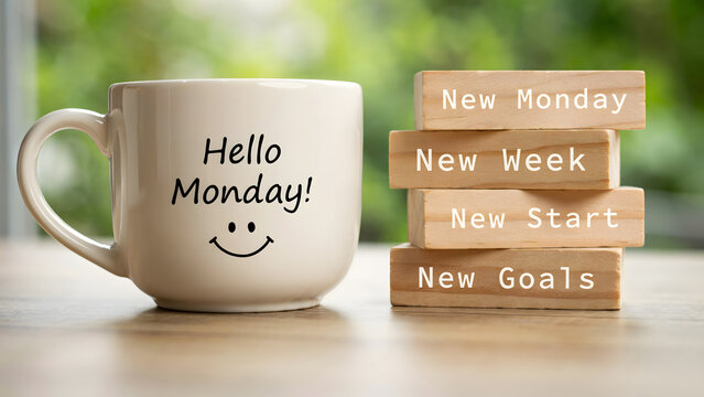 A cup of coffee next to a wooden stack with positive motivational words