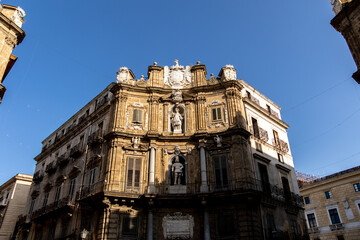 Fototapeta premium Low angle view of an ornate stone building facade in Palermo
