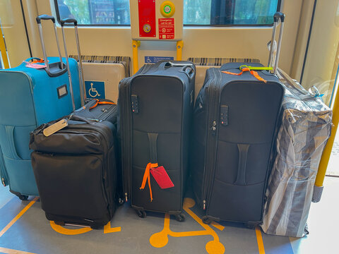 Suitcases and travel luggage inside a train carriage