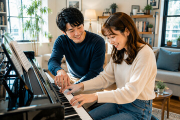 Fototapeta premium Couple Learning Piano At Home