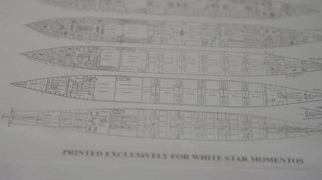 Closeup shot of detailed blueprint deck plans for the legendary RMS Titanic, perfect for historical documentaries or educational content.