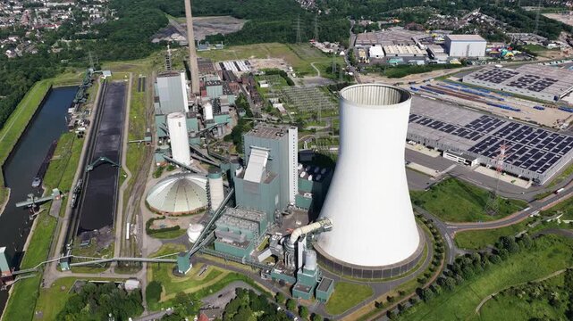 Aerial drone view of Duisburg Walsum power plant, showing coal energy infrastructure, chimney, industry and Rhine landscape.