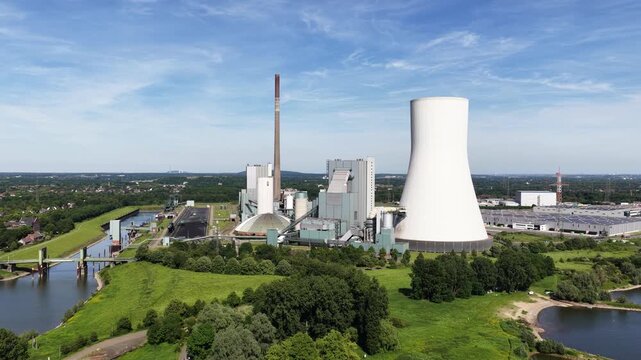 Aerial drone view of Duisburg Walsum power plant, showing coal energy infrastructure, chimney, industry and Rhine landscape.