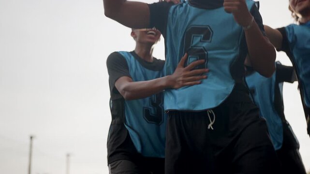 Football players celebrate a successful penalty goal, hugging teammates with joyful energy, illustrating determination, teamwork, emotional victory, competitive spirit, and memorable sporting.