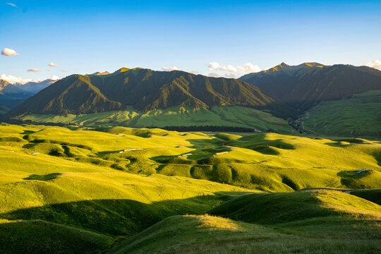 Rolling alpine grassland hills at sunset, Ili Xinjiang China
