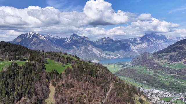 Drone view over Obersee near N&auml;fels in Glarus, Switzerland, alpine peaks, lake scenery, valleys and dramatic clouds., nature and outdoor adventure view.