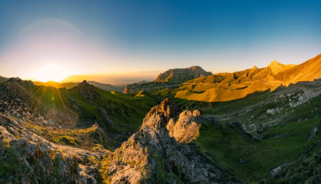 Alpine mountain scenery of Ili Valley Xinjiang China, grassland forest and rocky peaks at sunrise